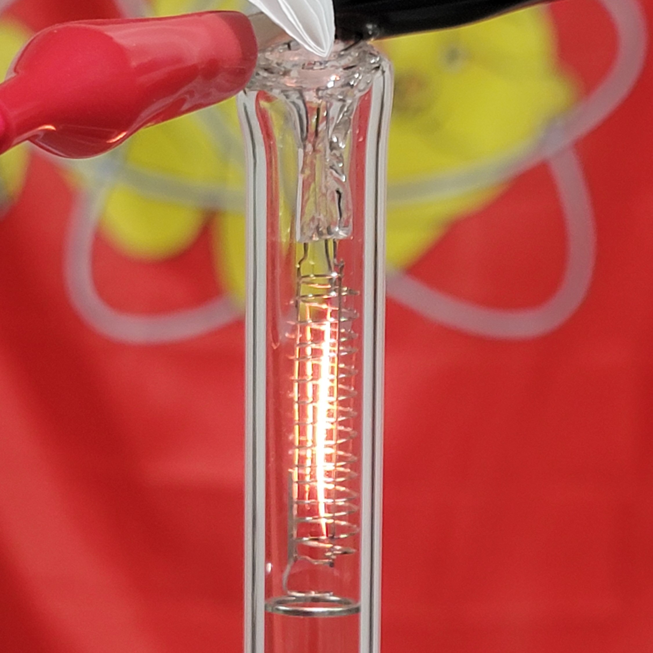 Close-up of the filament glowing inside the tube assembly