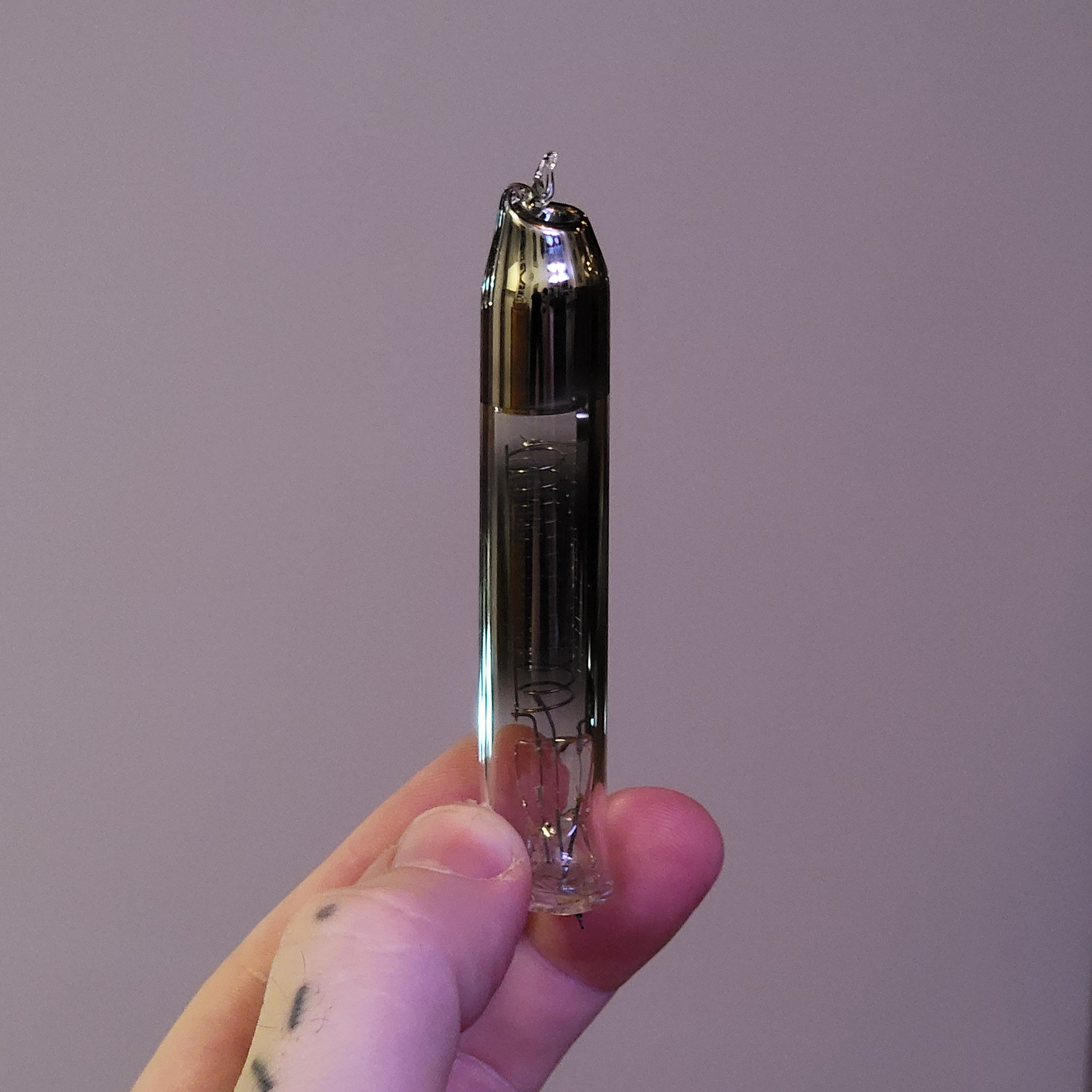 Close-up of the tube with a blown filament