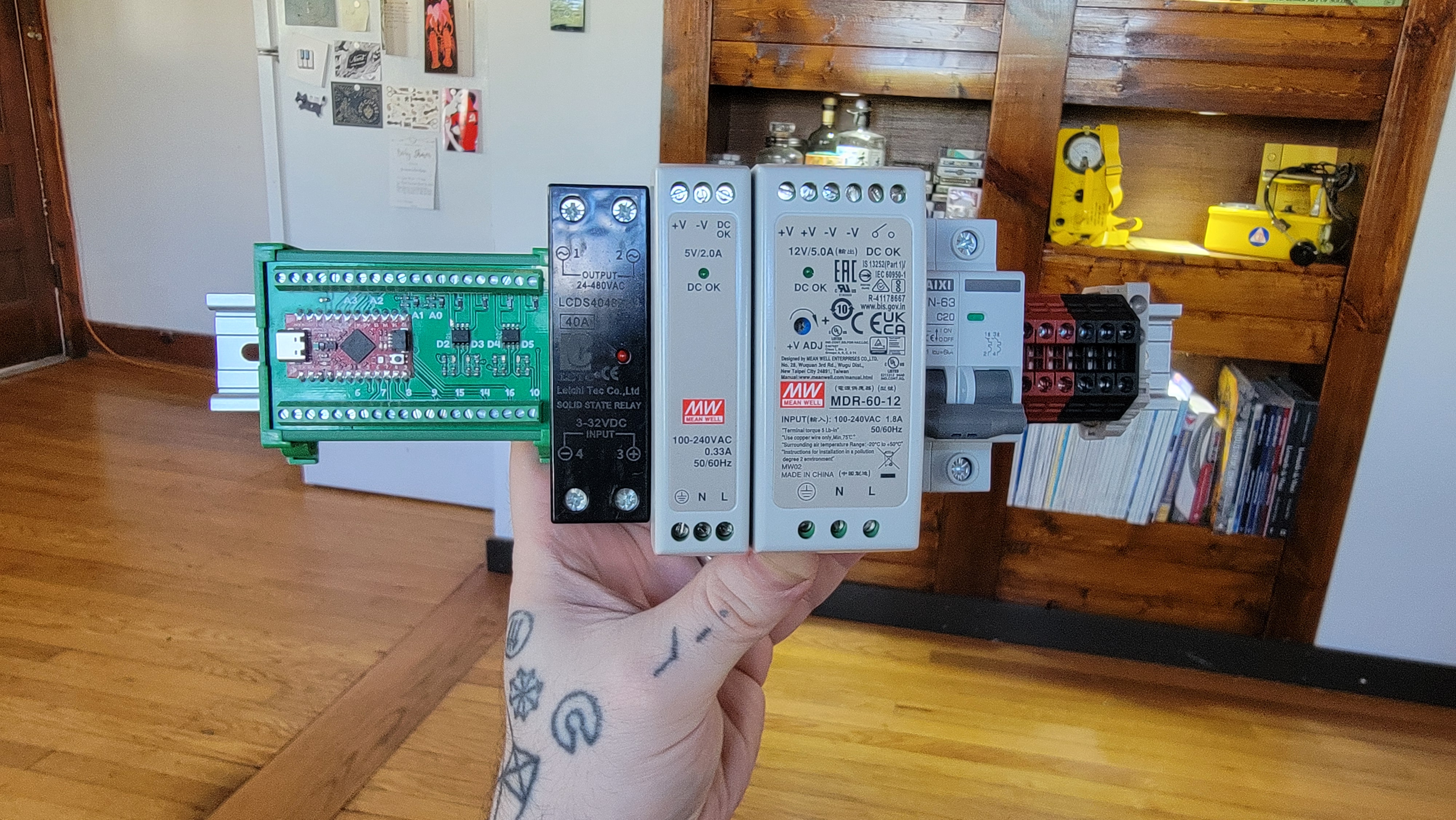 Several DIN modules mounted on a loose piece of DIN rail